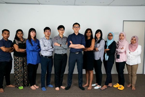 Alexander Ang's Ex Company Team Group Photo in 2018